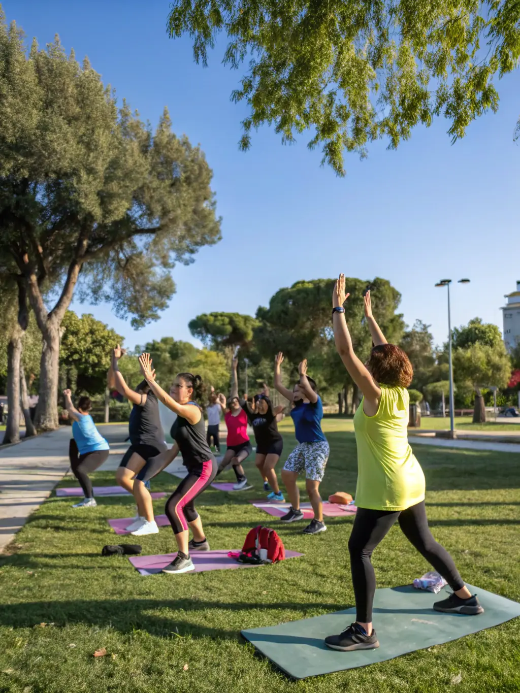 A motivational image of a group fitness class organized by RED WOLF 23, with participants exercising together under the guidance of a certified instructor.